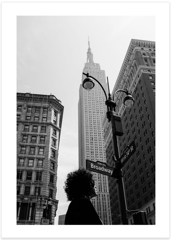 poster of a man in black clothes looking up in new york at empire state building, photo, photography by Gloria Salgado Gispert